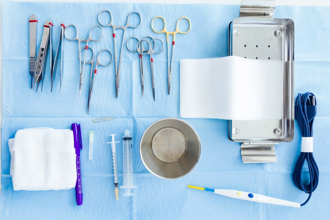 Stainless steel holloware instruments including kidney dish, dressing jars, and surgical trays